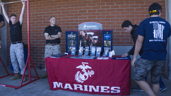 Marine Corps await their new recruitment with flyers and a chance to show some strength. Photo by Jake Winkle ('17)