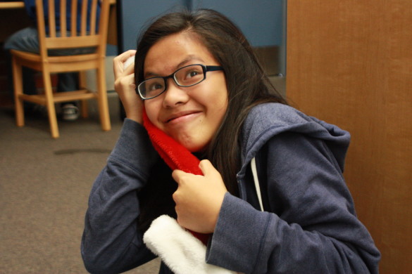 Linh Thai ('20) cuddles with her santa hat during this jolly holly holiday season.