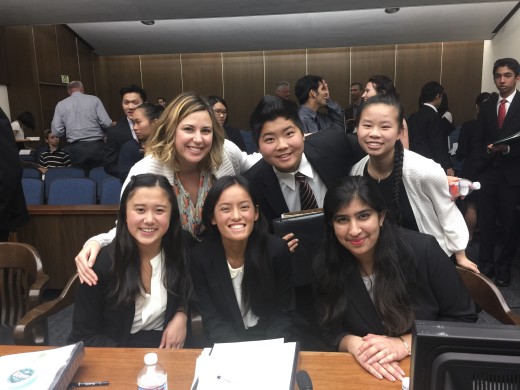 All smiles after the round with (top row, left to right) teacher coach Ms. Laframboise, Pretrial Attorney Ian Hsu ('18), Defendant Brigitte Doan ('18), (bottom, left to right) defense attorneys Kaitlyn Truong ('18), Ally LeNguyen ('17), and Divya Seth ('17). 