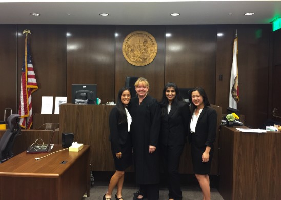 Defense attorneys with judge (left to right) Ally LeNguyen ('17), Presiding Judge Karen Scott, Divya Seth ('17), and Kaitlyn Truong ('18). Photo by John Le. 